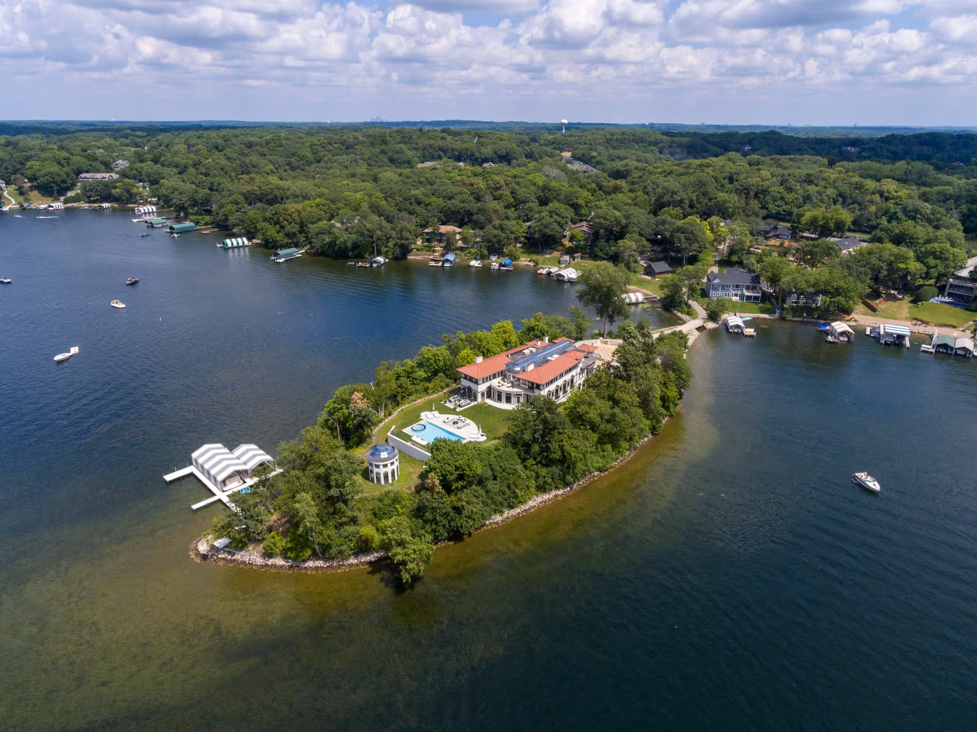 Aerial view of Greenwood, Minnesota, showing lakefront homes wrapped around St. Albans Bay on Lake Minnetonka.